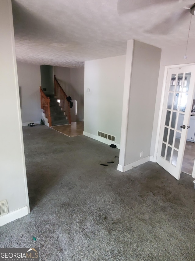 interior space featuring a textured ceiling