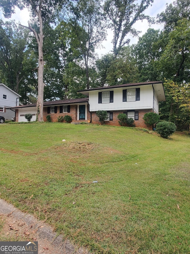 tri-level home with a front lawn