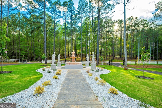 view of home's community with a lawn