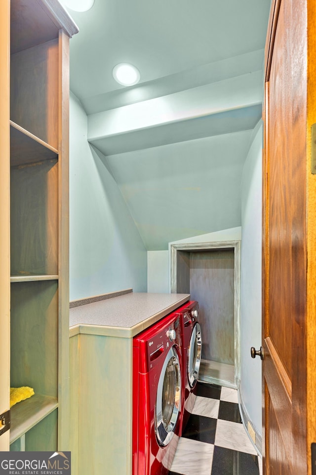 clothes washing area featuring washing machine and clothes dryer