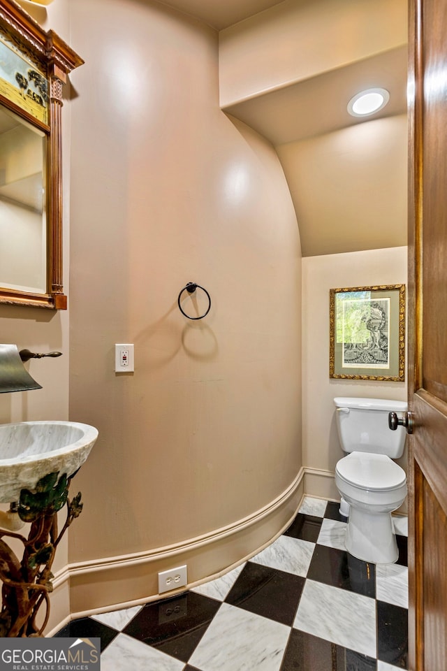 bathroom featuring toilet