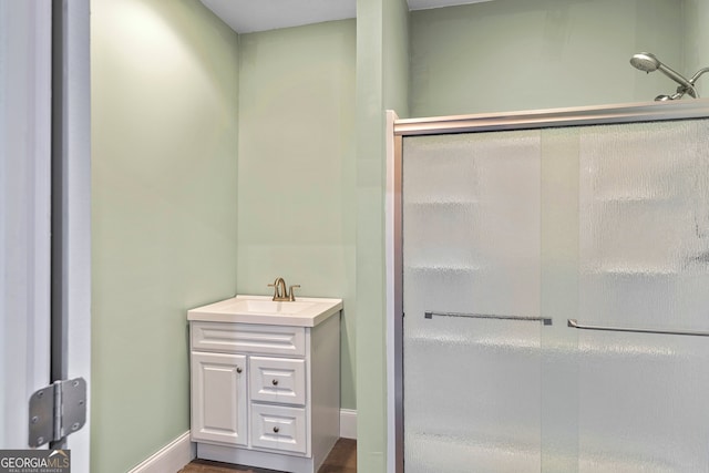 bathroom with vanity and an enclosed shower