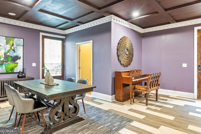 dining room with light hardwood / wood-style flooring, coffered ceiling, and crown molding