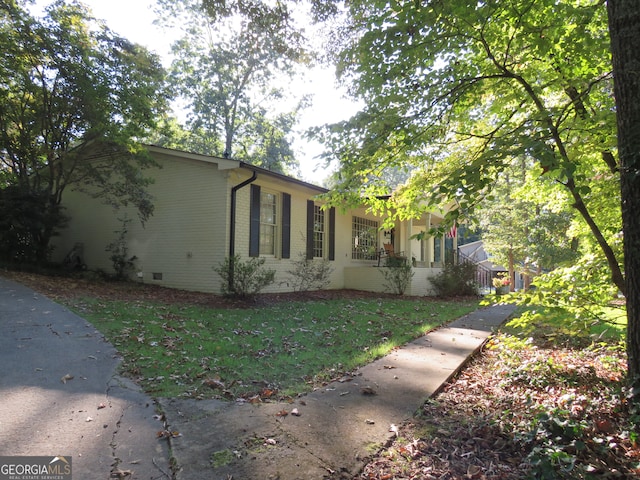 view of home's exterior featuring a lawn