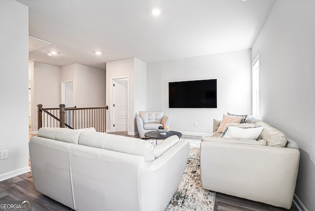 living room featuring dark wood-type flooring