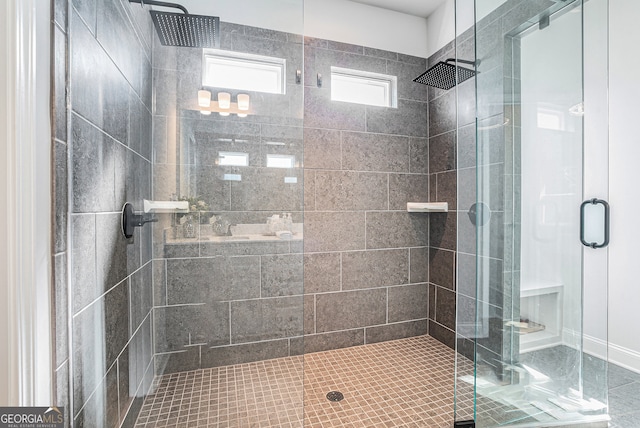 bathroom with a shower with shower door