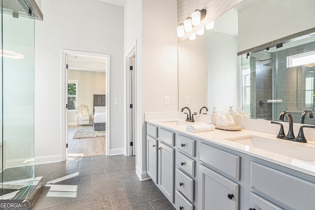 bathroom with walk in shower, vanity, and hardwood / wood-style flooring