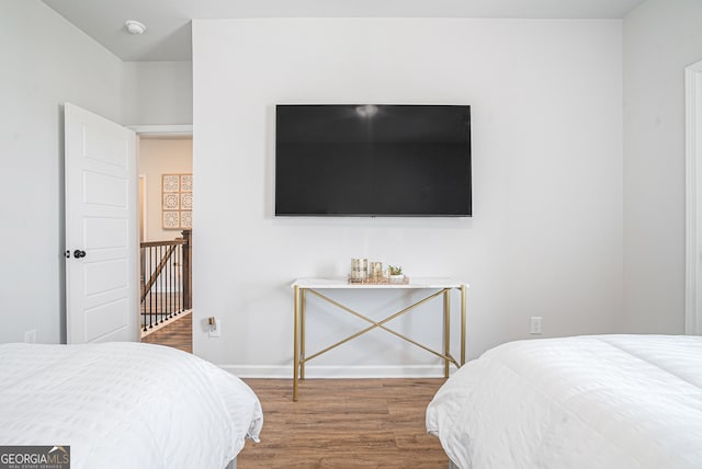 bedroom with wood-type flooring