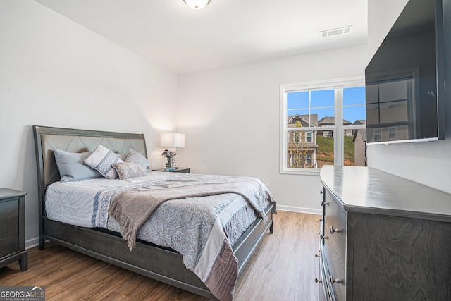 bedroom featuring hardwood / wood-style floors