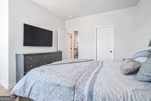 bedroom with light hardwood / wood-style flooring