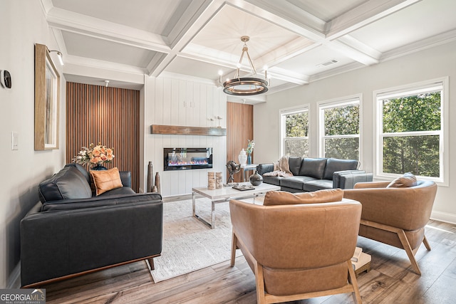 living room featuring coffered ceiling, hardwood / wood-style flooring, and beam ceiling