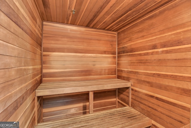 view of sauna / steam room with wood walls and wooden ceiling