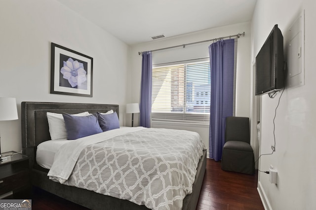 bedroom featuring dark wood-type flooring