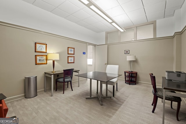 carpeted office featuring a drop ceiling