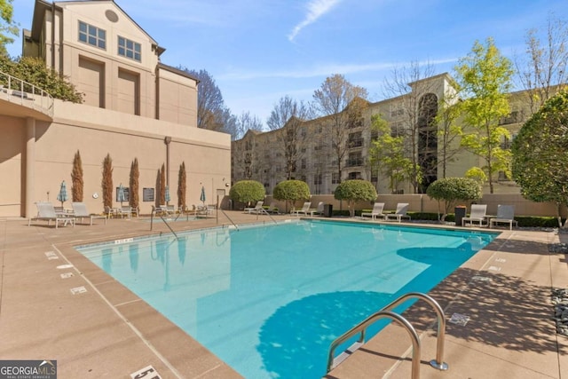 view of swimming pool with a patio area