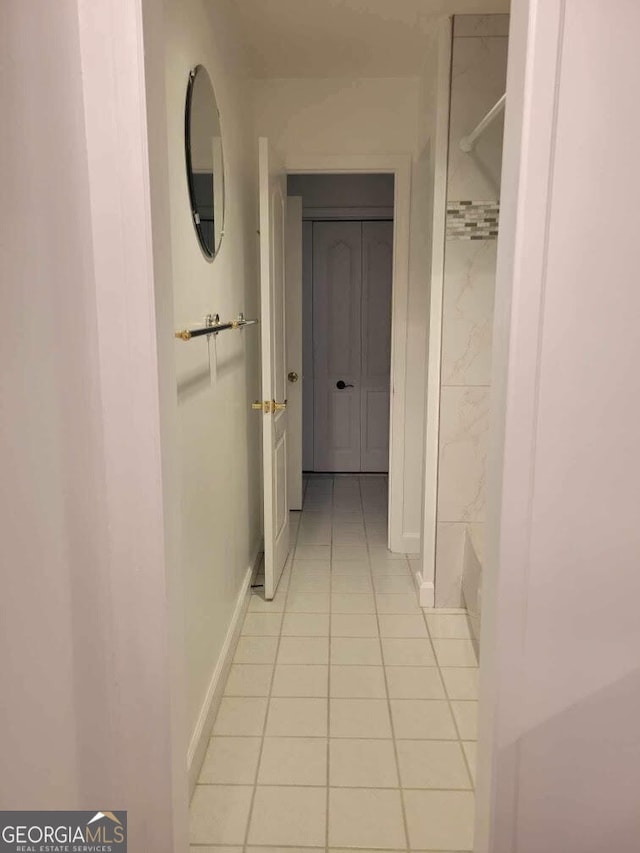 hallway with light tile patterned floors