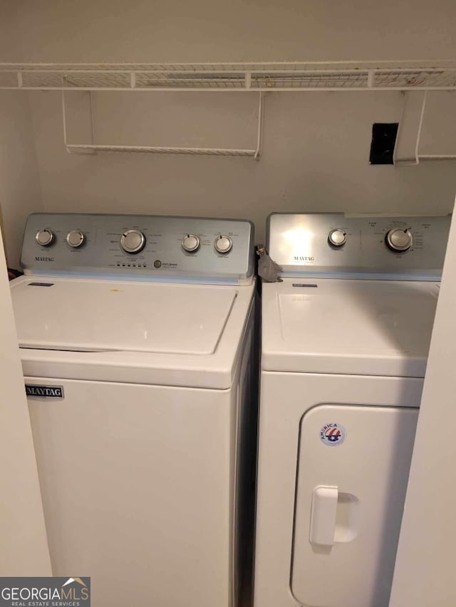 laundry area with washer and clothes dryer