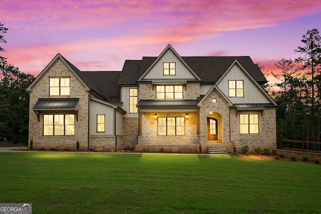 view of front of property with a lawn