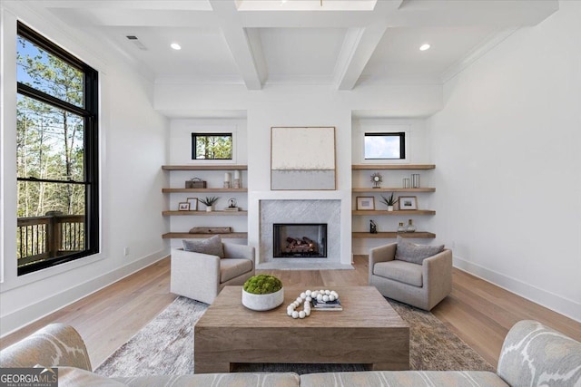 612 Forest Pointe Dr, Forsyth, GA 31029 - living area featuring a premium fireplace, light wood-type flooring, beamed ceiling, recessed lighting, and coffered ceiling