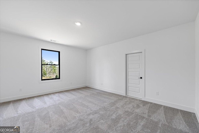 612 Forest Pointe Dr, Forsyth, GA 31029 - carpeted empty room featuring baseboards