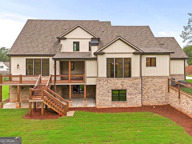 back of house with a yard and a patio