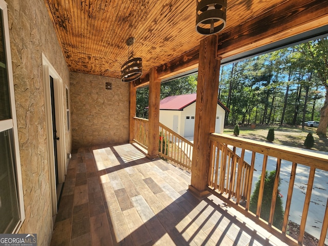 unfurnished sunroom featuring wooden ceiling