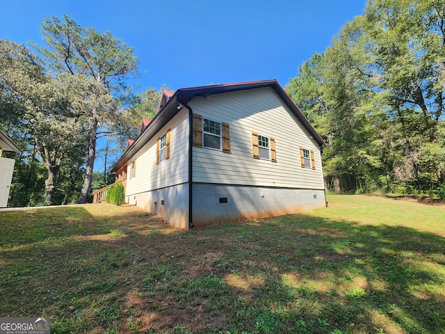 view of home's exterior featuring a lawn