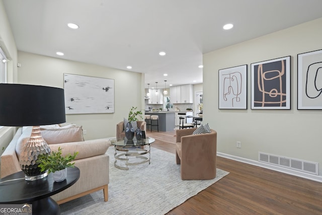 living room with wood-type flooring