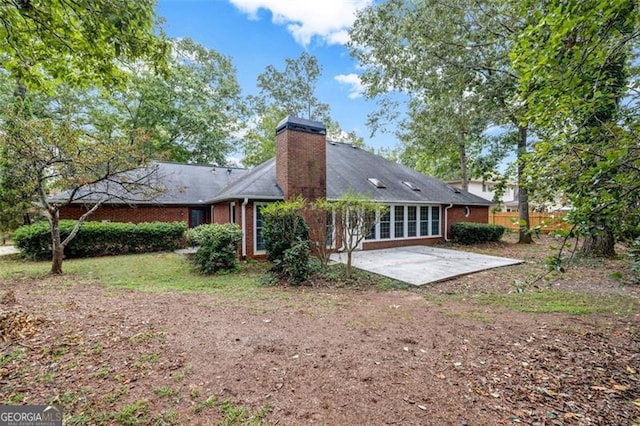 back of property featuring a patio area