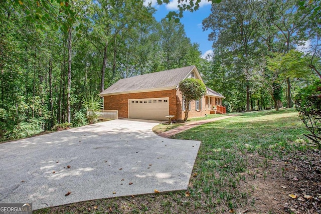 view of property exterior featuring a lawn and a garage