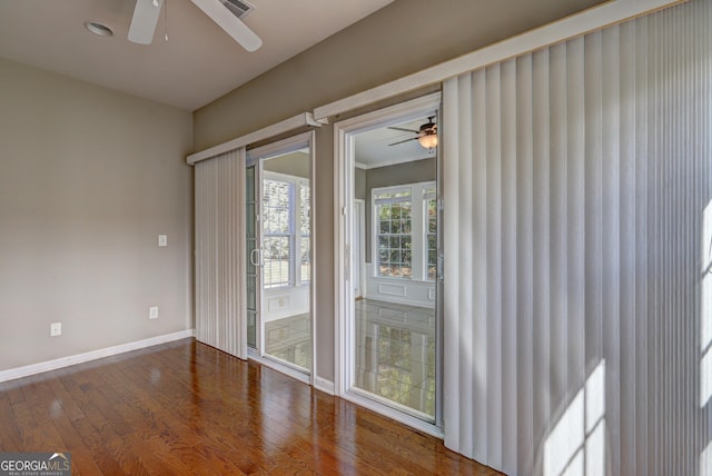 spare room with dark wood-type flooring