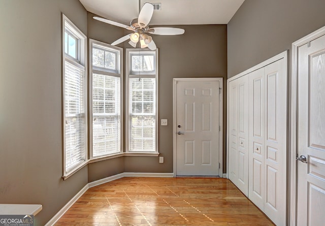 entryway featuring light hardwood / wood-style floors, plenty of natural light, and ceiling fan