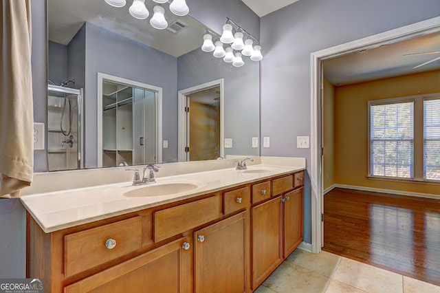 bathroom featuring vanity, tile patterned floors, and ceiling fan