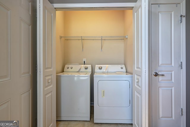 laundry area with washing machine and clothes dryer