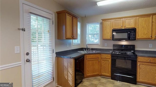 kitchen featuring sink and black appliances