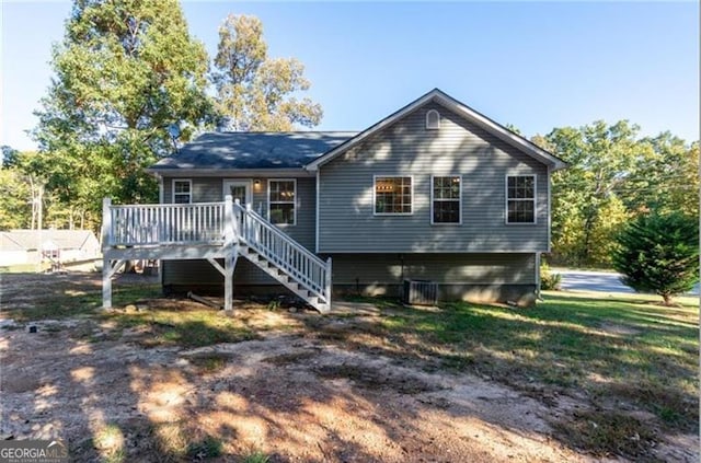 rear view of house with a wooden deck