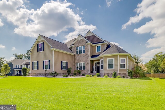 craftsman inspired home with a front yard