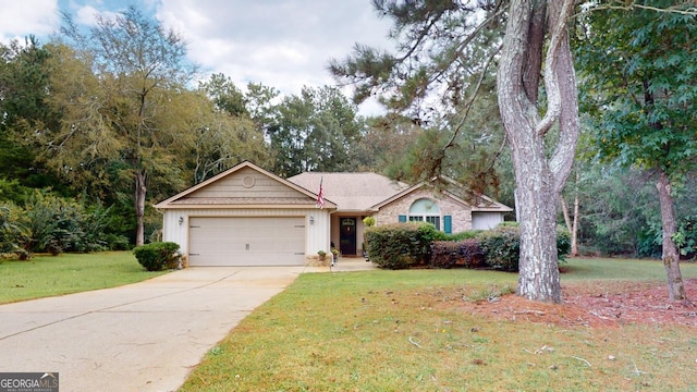 ranch-style home with a garage and a front yard