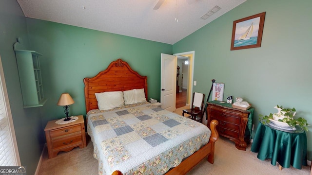 bedroom featuring light carpet, ceiling fan, and lofted ceiling