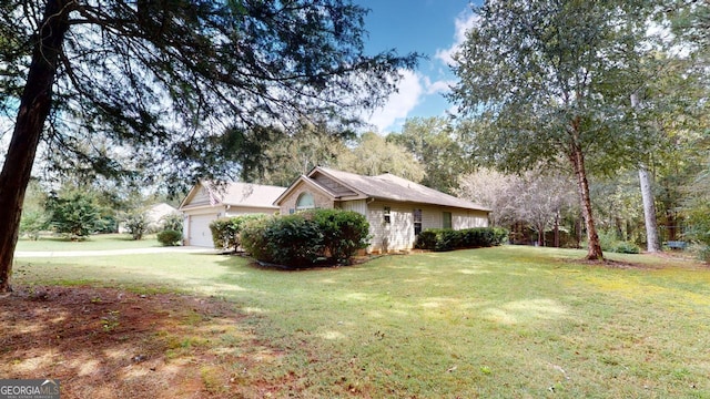 view of property exterior featuring a garage and a yard