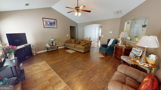 living room featuring ceiling fan, vaulted ceiling, and hardwood / wood-style floors