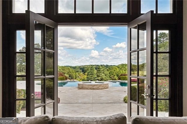 doorway to outside featuring a wealth of natural light and french doors