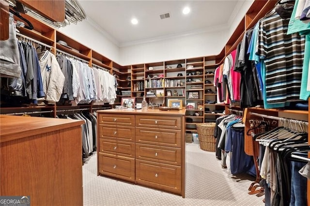 spacious closet featuring light carpet