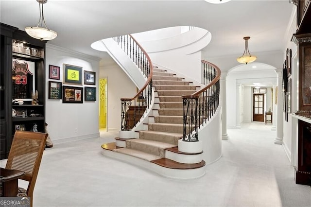 stairs with crown molding