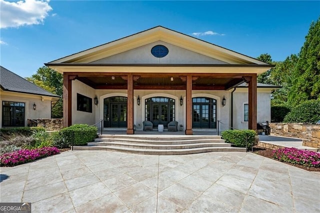 exterior space featuring french doors and covered porch