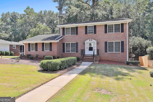 view of front facade featuring a front yard