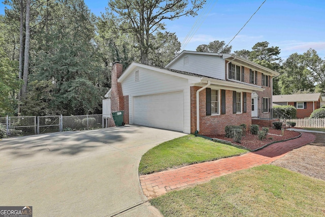 view of front facade with a garage and a front yard