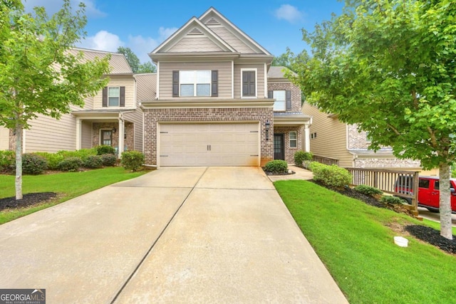 view of front of home with a front yard and a garage