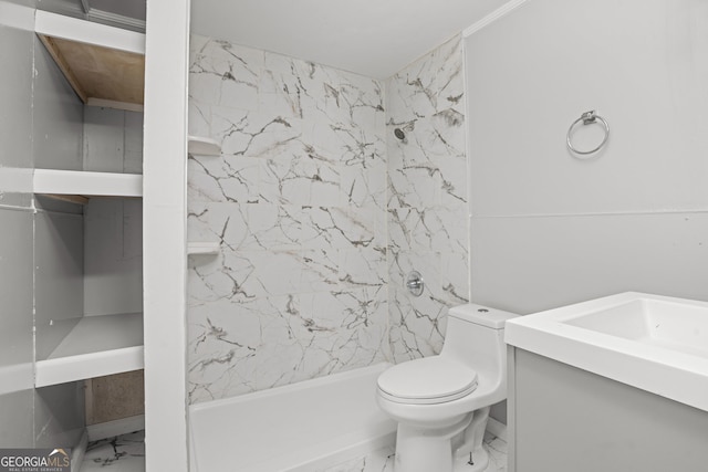 bathroom featuring tiled shower, vanity, and toilet