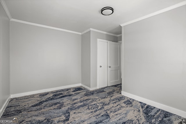 unfurnished bedroom featuring dark colored carpet and ornamental molding